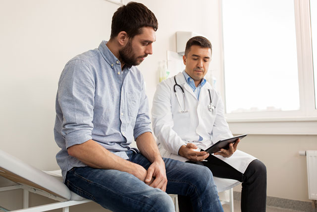 Doctor explaining to the patient the steps to follow with heart disease. Taking care of your heart